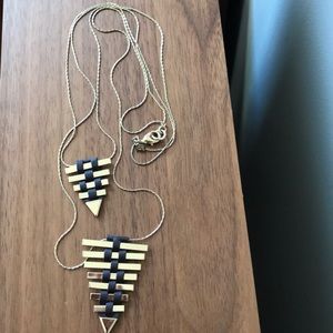 Gold tone necklace with dark brown leather accent